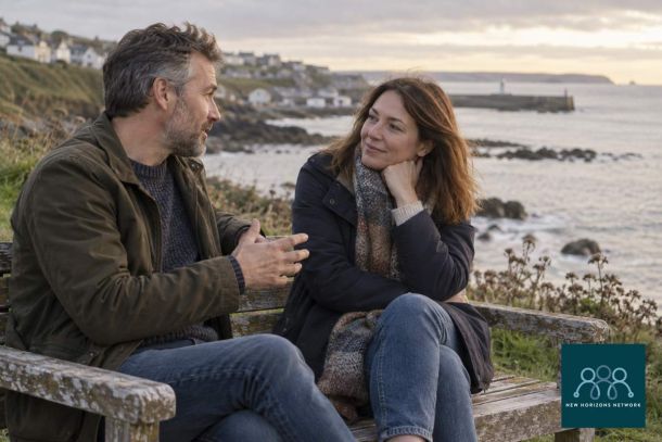 Two adults having a supportive conversation representing connection on World Suicide Prevention Day.