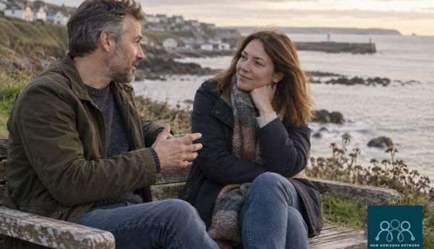 Two adults having a supportive conversation representing connection on World Suicide Prevention Day.